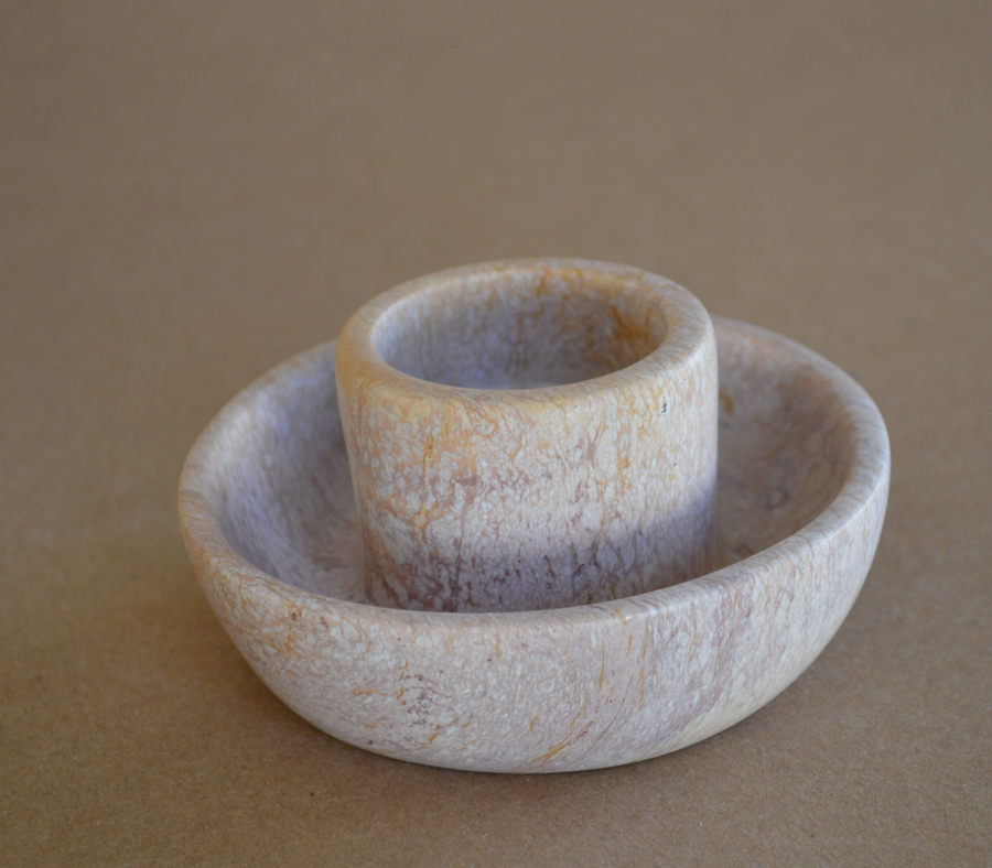 Close-up of handcarved Kisii soapstone candle holder showing natural stone texture