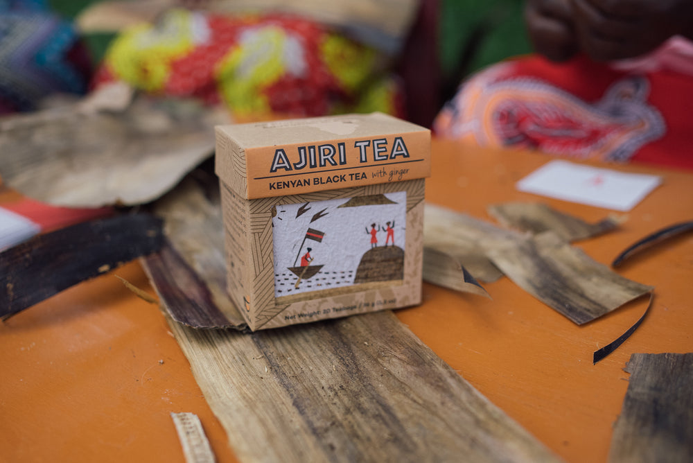 A woman in western Kenya handcrafting an Ajiri banana-bark label